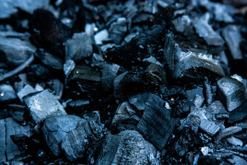 Dark blue coal. Texture. The coal on the dark background