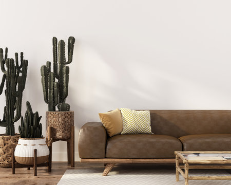 Boho-style interior with leather sofa and cacti