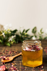 Honey jar with petals