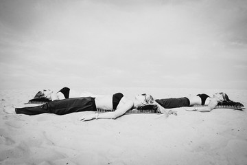 extreme yoga relaxation and self-development - beautiful women laying nacked back on the board with...