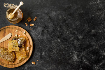 Top view honeycombs with honey jar