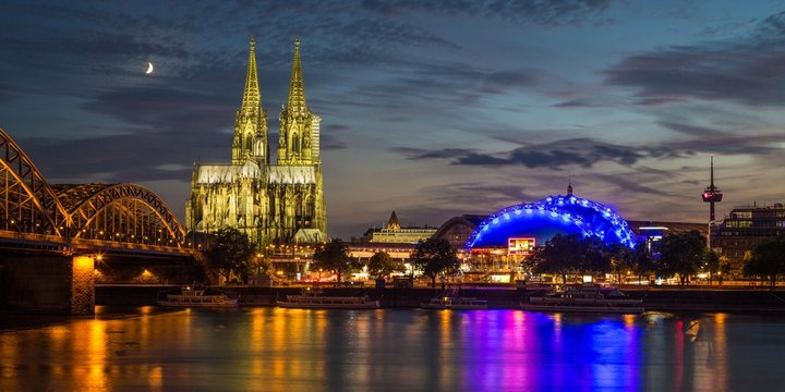 City-panorama of Cologne at dusk, Rhine, Hohenzollern Bridge, cathedral, the Musical Dome, Colonius TV tower, rising moon behind, Cologne, North Rhine-Westphalia, Germany, Europe