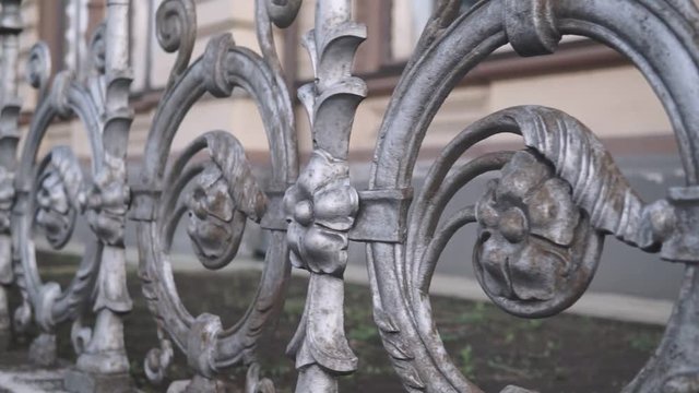 Forged fence close-up slow pan shot.
