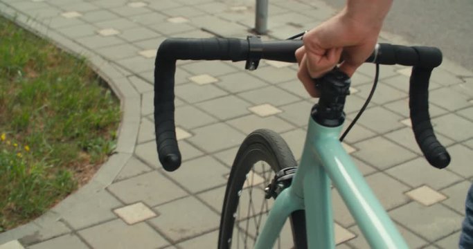 Cyclist man riding fixed gear sport bike