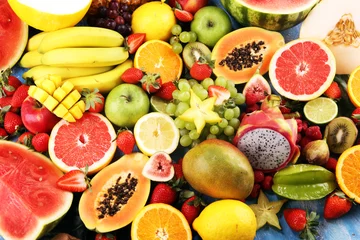 Fotobehang Tropical fruits background, many colorful ripe fresh tropical fruits © beats_