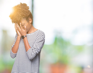 Fototapeta na wymiar Beautiful young african american woman wearing glasses over isolated background with sad expression covering face with hands while crying. Depression concept.