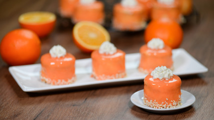 Orange cakes with mirror glaze.