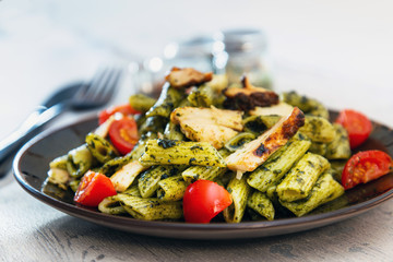 Penne cooked cereal specialty with cooked chicken fillets and a sauce made with olive oil © ilolab