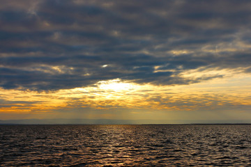 Сolorful sky with clouds over lake and water in lake reflect