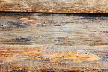 yellow brown wooden board texture with cracks, stains and scratches