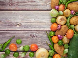 Fresh local vegetables in Asia on a wooden table