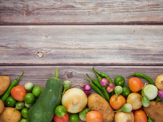 Fresh local vegetables in Asia on a wooden table