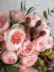 Beautiful wedding bouquet of shrub and peony gently pink roses.