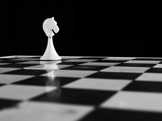 chess pieces on the board on a black background
