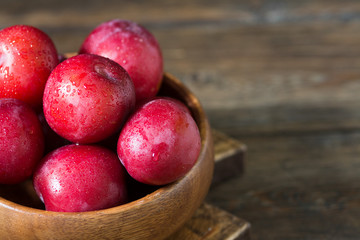 Red plum. Healthy diet. Rustic style