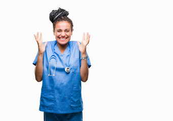 Young braided hair african american girl professional surgeon over isolated background celebrating...