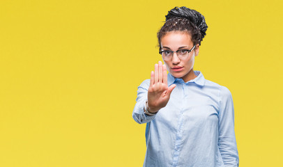 Young braided hair african american business girl wearing glasses over isolated background doing...