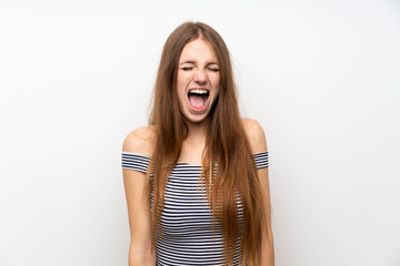 Young woman with long hair over isolated white wall shouting to the front with mouth wide open