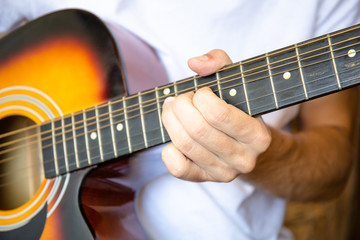Fototapeta na wymiar close up of an acoustic guitar player