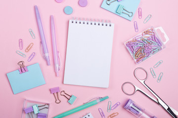 School background with notebooks and pastel colorful study accessories on pink background Back to school concept with copy space for text