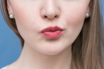 The face of a beautiful woman, pout lips, playful woman, close up