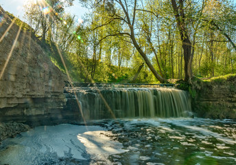 Waterfall on the river Sablinka in the village of Ulyanovsk, Leningrad region.