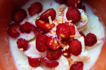 ice cream in a plate with strawberries. dessert
