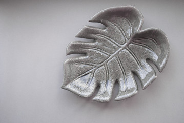 Ceramic leaf palm closeup. background