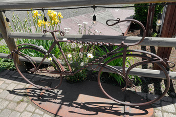 Old world street decorations surrounded by flowers
