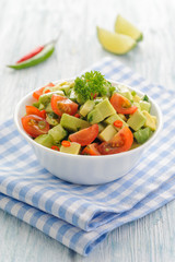 Salsa from avocado, cherry tomatoes and lime.
