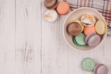 Top view of set macaron on white table background. Traditional french dessert. Delicious food