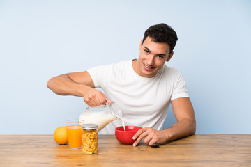 Handsome man in having breakfast