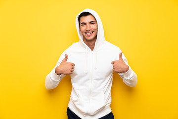 Handsome sport man over isolated background with thumb up