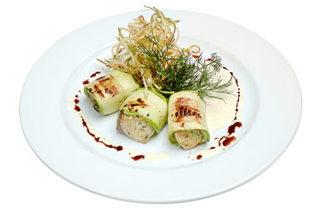 Seafood, Mediterranean cuisine. Vegetable rolls from sea fish. Japanese food on a plate isolated white background. Close-up.