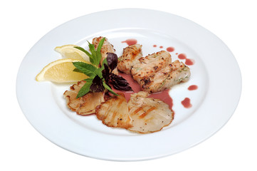 Fried fish with lemon and mushrooms isolated on a white background. Close-up.