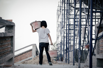 Children are forced to work in the construction area. Human rights concepts, stopping child abuse,...