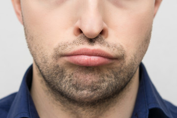 Fototapeta premium Sadness on a person's face, close up, cropped image