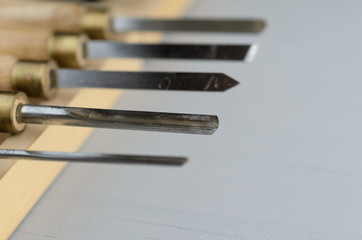 used wood lathe chisels on the wooden table
