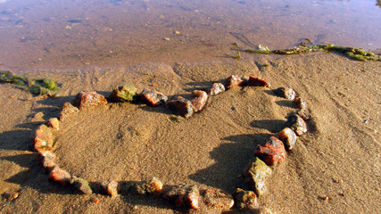 The photo shows a heart of stones