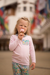 Fototapeta premium little girl eating ice cream