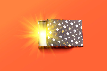 Black half open gift box with golden stars on orange coral background. Magic light coming from...