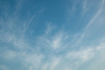 white cirrus cloudy on blue sky