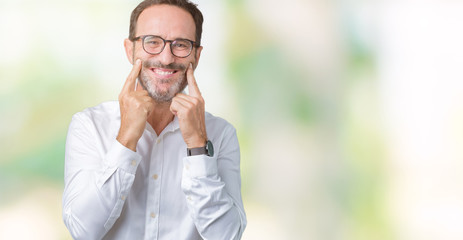 Handsome middle age elegant senior business man wearing glasses over isolated background Smiling with open mouth, fingers pointing and forcing cheerful smile