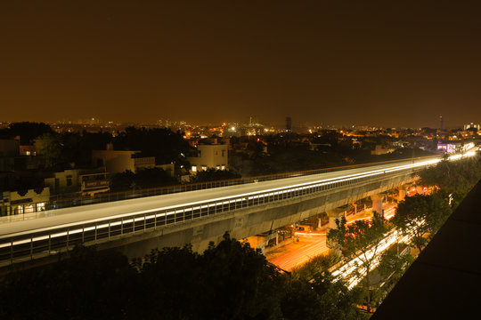 Long exposure shot of Bengaluru Metro train moving on the bridge new Mysore road Bengaluru, India.