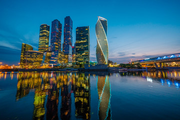 Illuminated Moscow City skyscrapers at evening