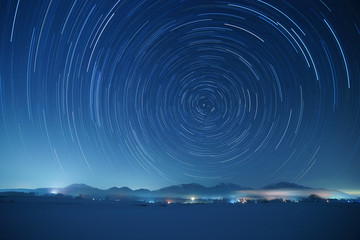 Star trails over Mt. Hiruzen and Mt. Daisen in winter