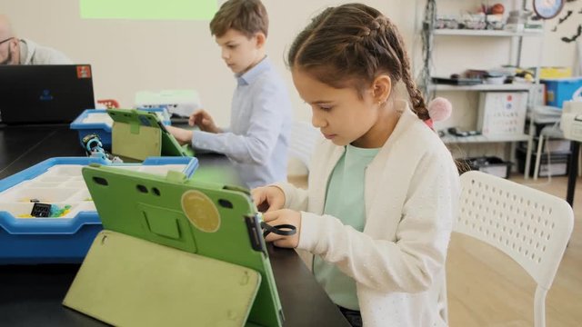 E-learning educational class for kids with smart boys and girls front view slow motion