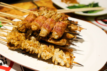 grilled squid , grilled pork and barbecued bacon
