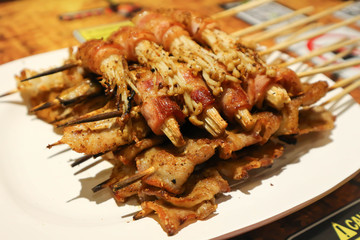 grilled squid , grilled pork and barbecued bacon