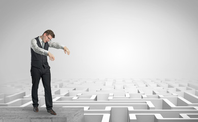 Zombi elegant businessman on the top of a labyrinth
